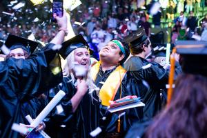 Individuals celebrate at Graduation